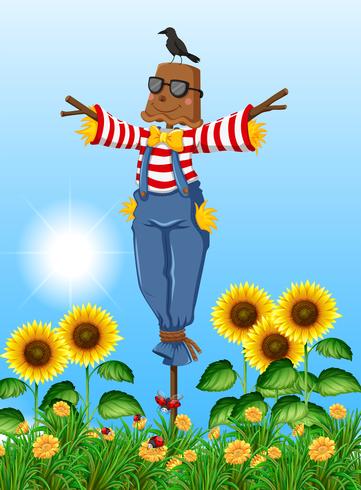 Scarecrow standing in sunflower field vector