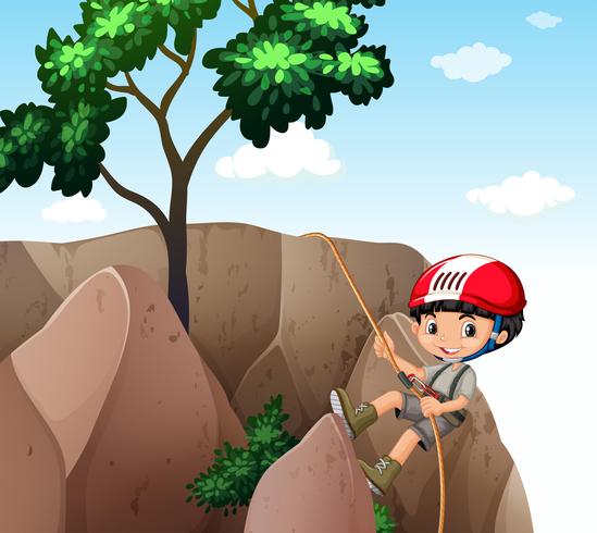 Boy climbing up the cliff vector