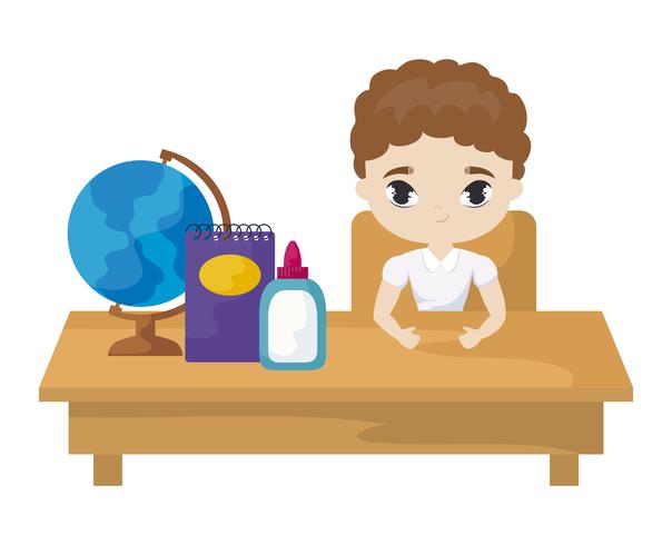 student boy sitting in school desk with supplies education