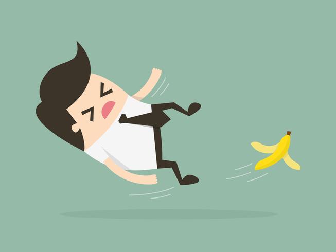 Businessman slipping on a banana peel vector