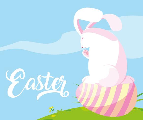 cute rabbit with egg of easter in grass vector