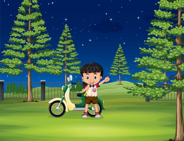 Niño y moto en el parque de noche vector