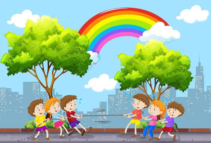 Niños jugando tira y afloja con paisaje urbano vector