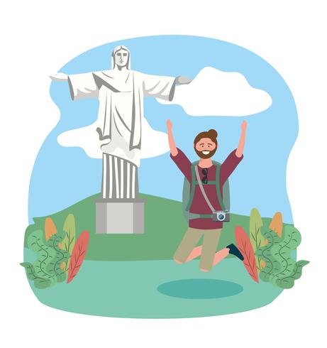 Turista masculino saltando delante de la estatua del Cristo Redentor vector