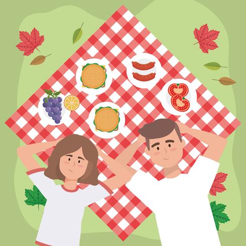 Aerial view of man woman relaxing on picnic blanket  vector