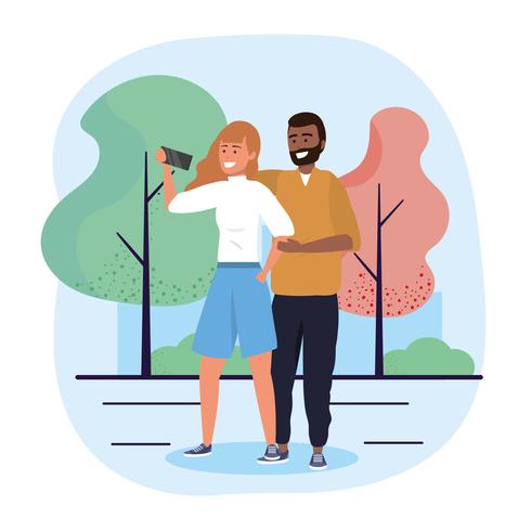 Hombre y mujer tomando selfie en parque vector