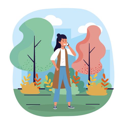 Young woman talking on smartphone in park  vector