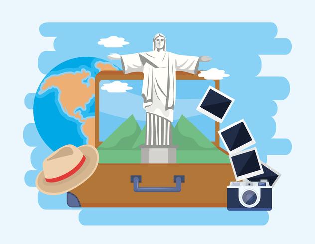 Christ the redeemer statue in suitcase with camera and hat  vector