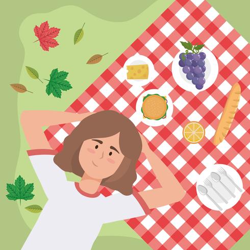 Aerial view of woman relaxing on picnic blanket  vector