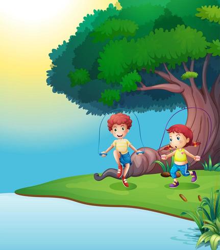 A boy and a girl playing near the giant tree vector