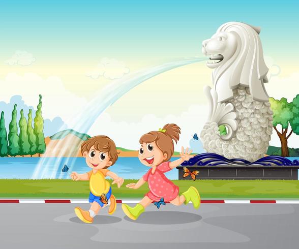 Dos niños jugando cerca de la estatua de Merlion vector