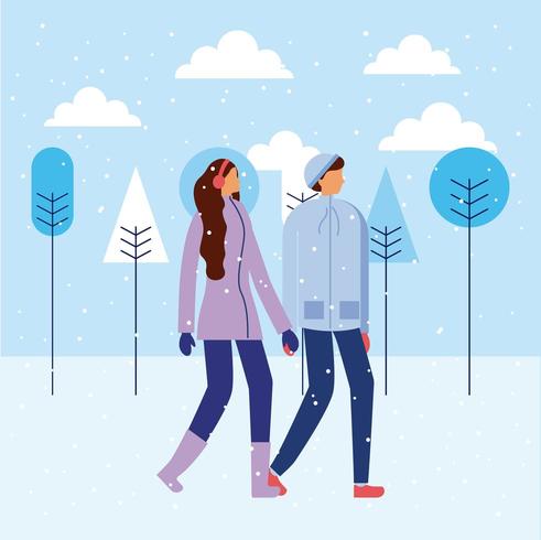 Feliz pareja tomados de la mano en invierno vector