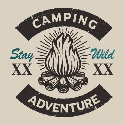 Vintage emblema de camping con una hoguera. vector