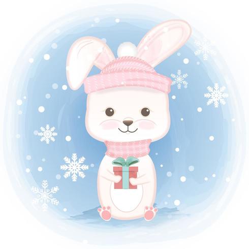 Rabbit holding gift box and snowflake  vector