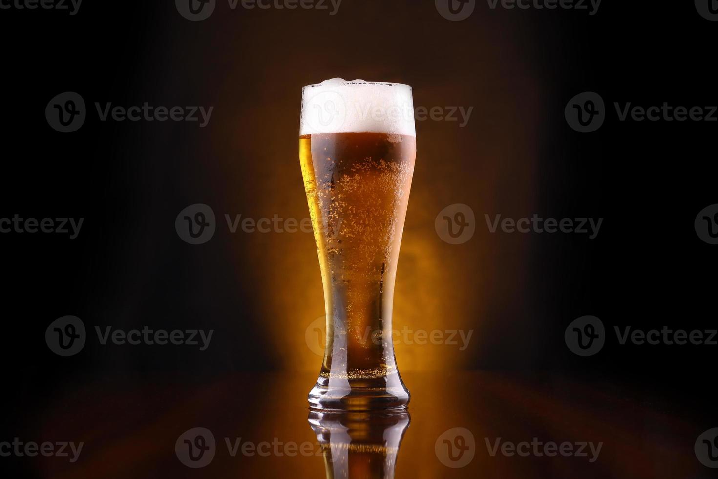 Glass of light beer photo