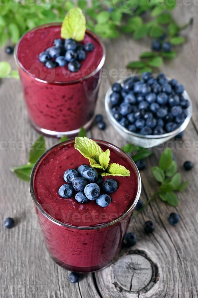 Glasses of blueberry smoothie photo
