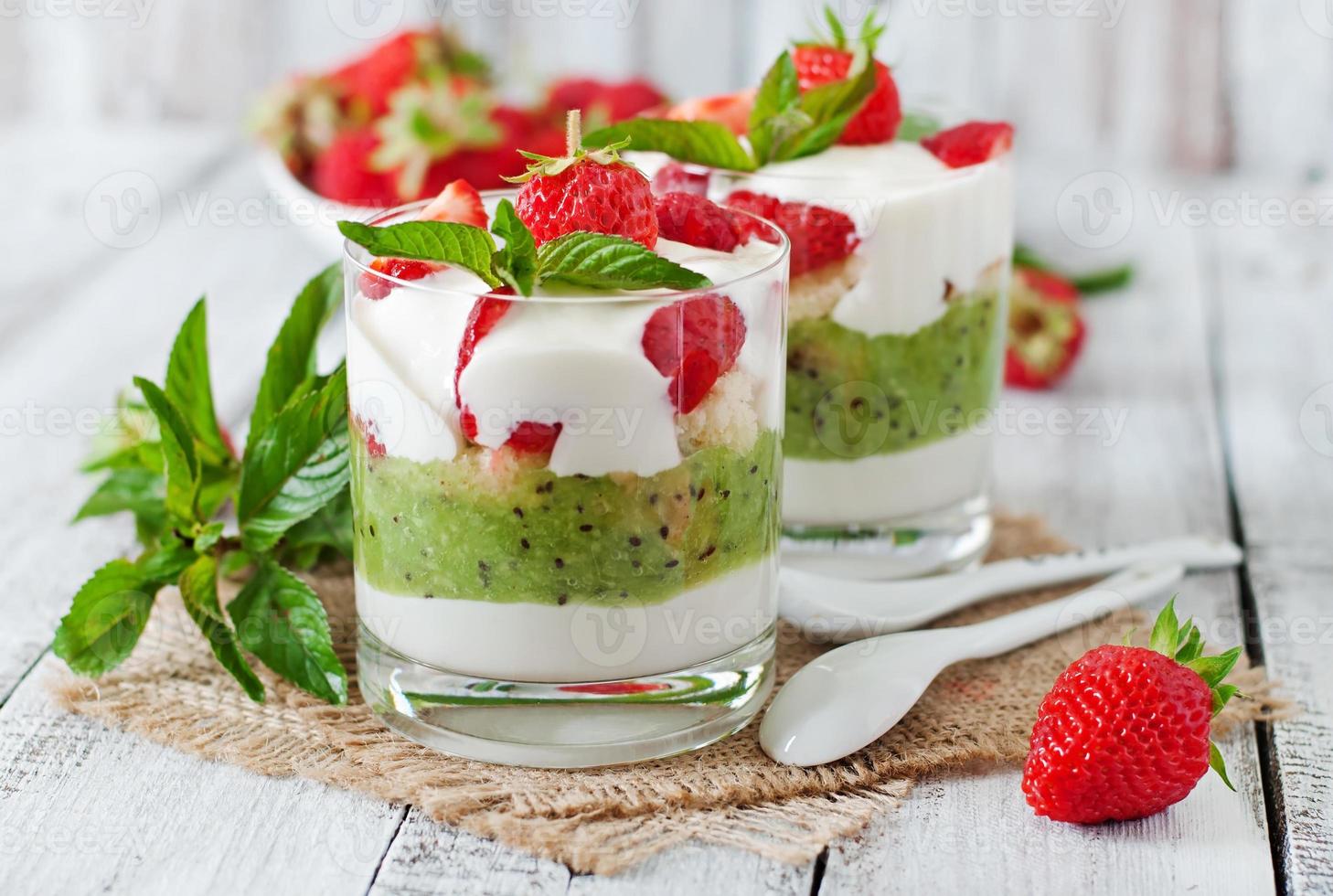 Creamy dessert with strawberries and kiwi photo