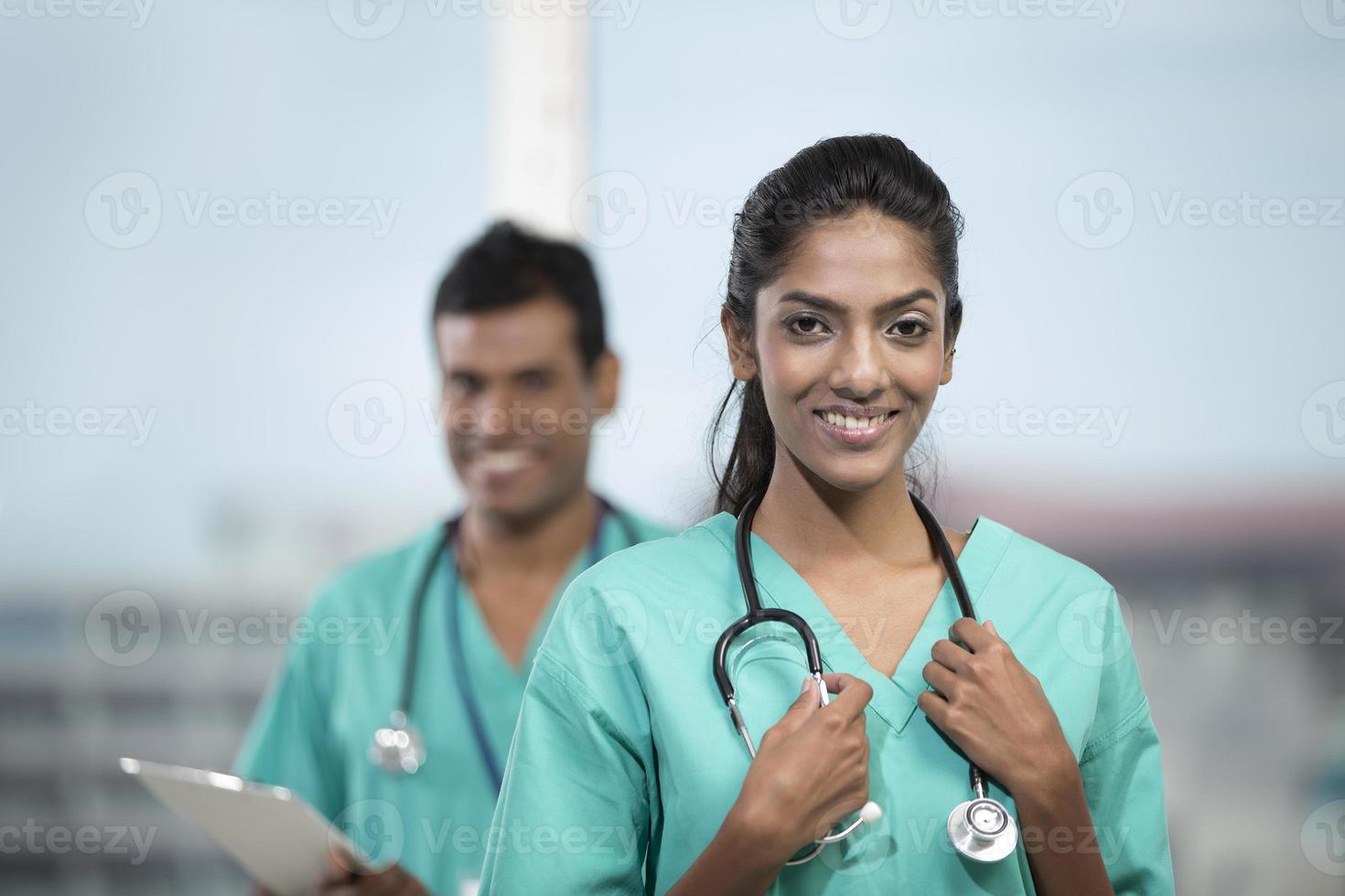 Female Indian doctor with her colleague photo