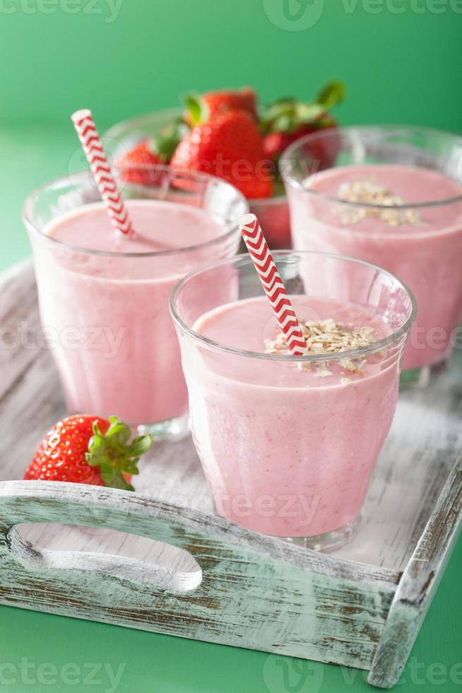 healthy strawberry oat smoothie in glass photo
