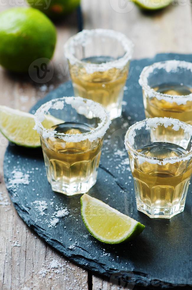 Gold tequila with lime and salt photo