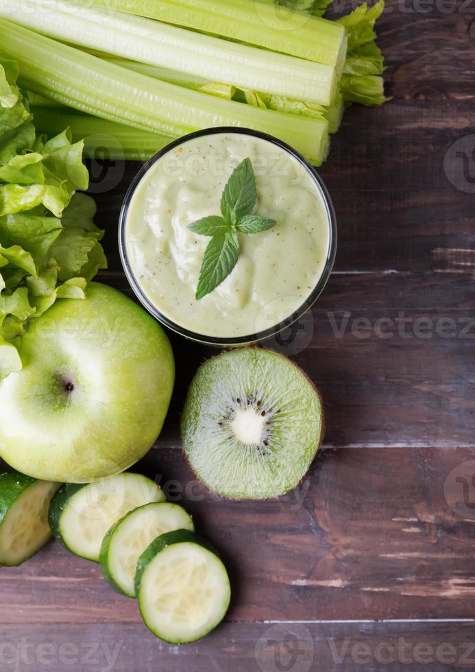 Green smoothie, vegetables and fruits photo