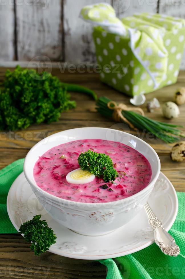 Cold beet soup with egg, cucumber, potatoes and greens photo