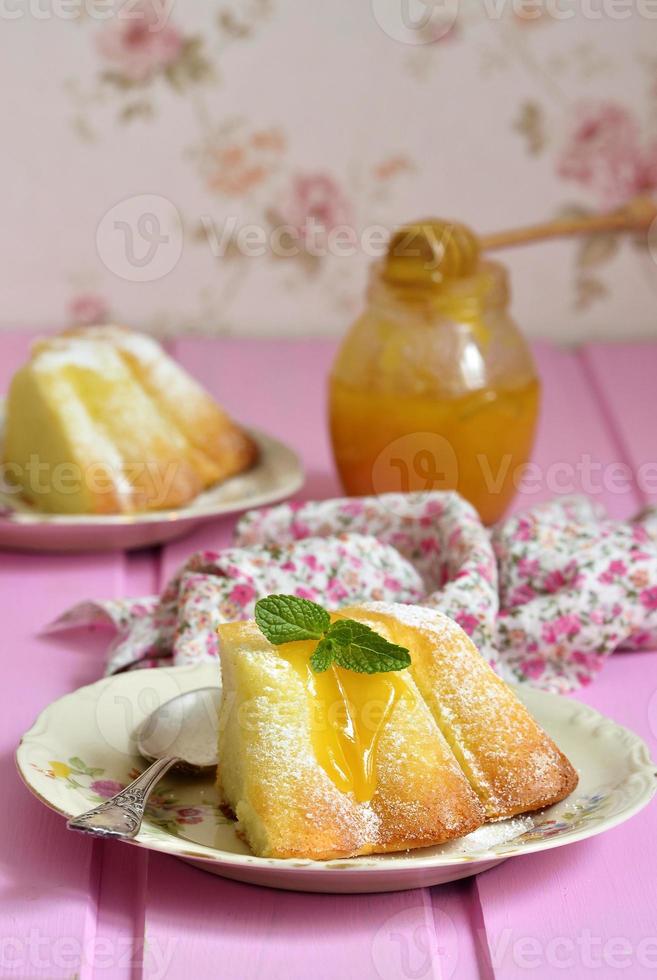 Piece of curd casserole (pudding) with honey dressing. photo