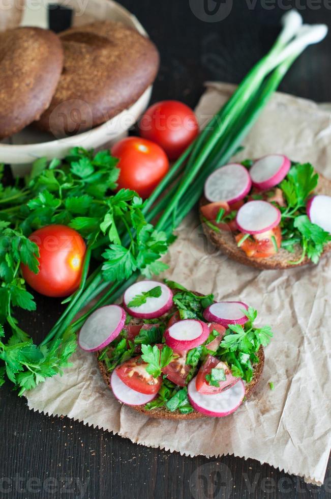 Italian tomato bruschetta with chopped vegetables, herbs and oil photo