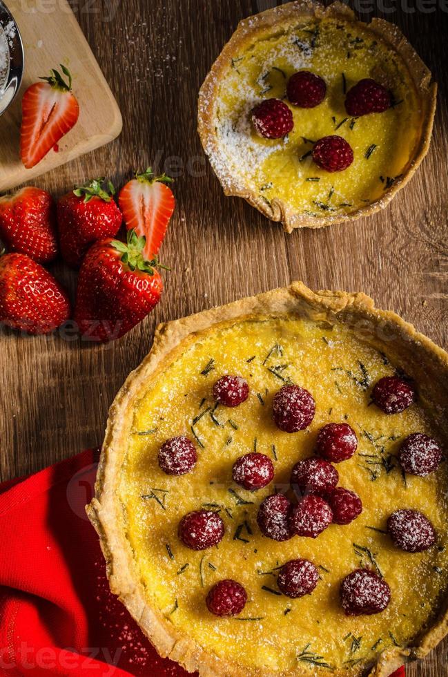 Lemon tart with rosemary and berries photo
