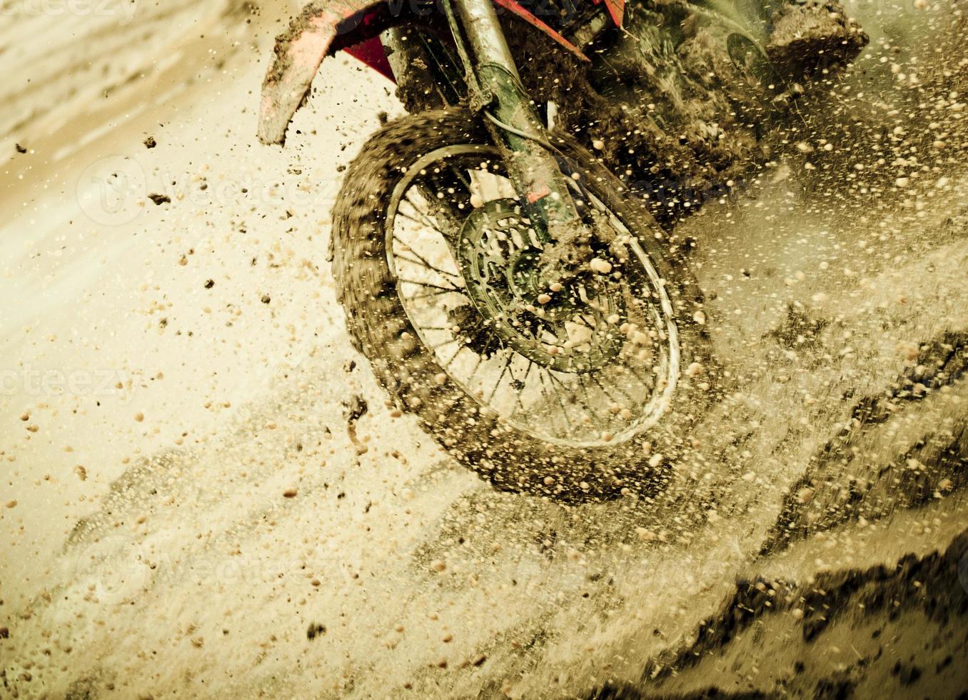 Motocross detail of splashing mud photo