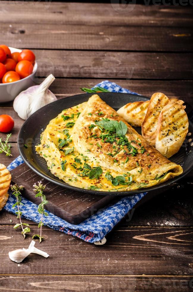 Herb omelette with chives and oregano photo