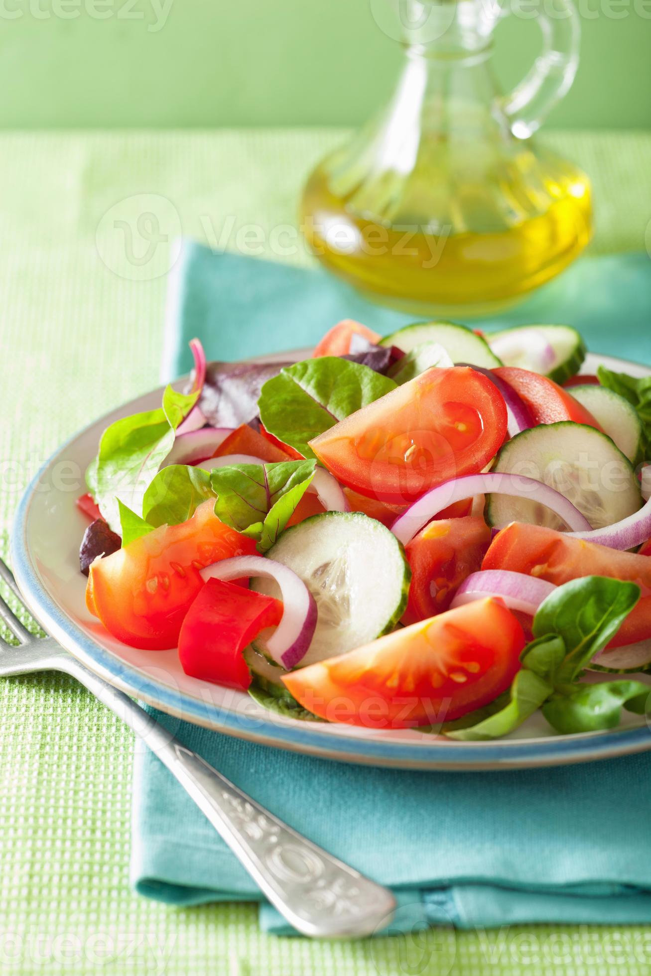 healthy tomato salad with onion cucumber pepper photo
