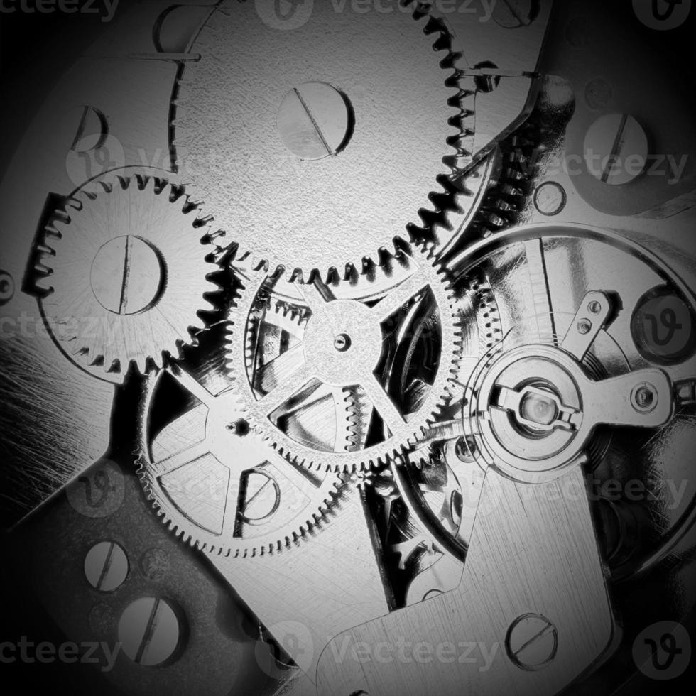 mecanismo de relojería con engranajes y ruedas dentadas foto