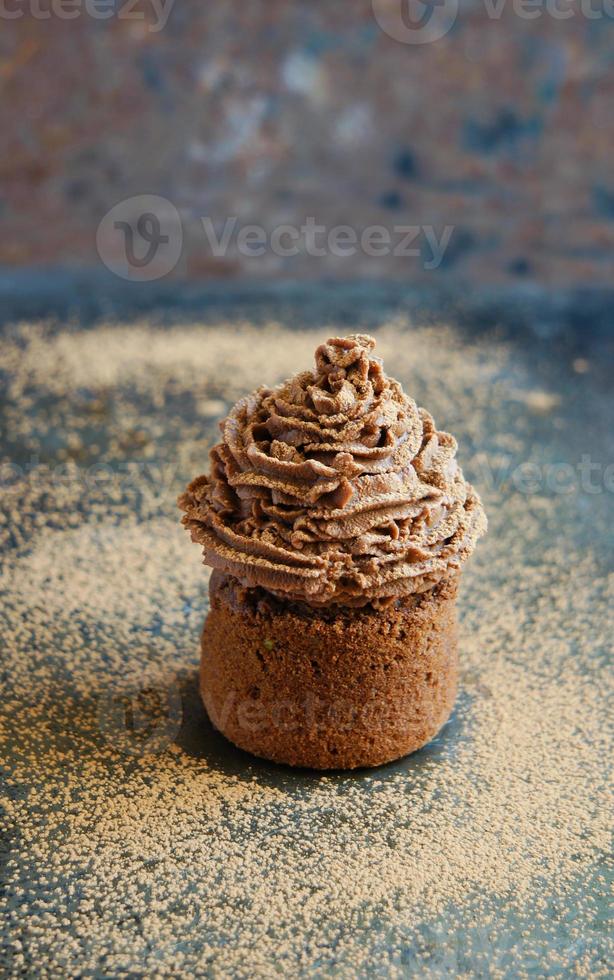 Chocolate cupcake with chocolate cream cheese cream photo