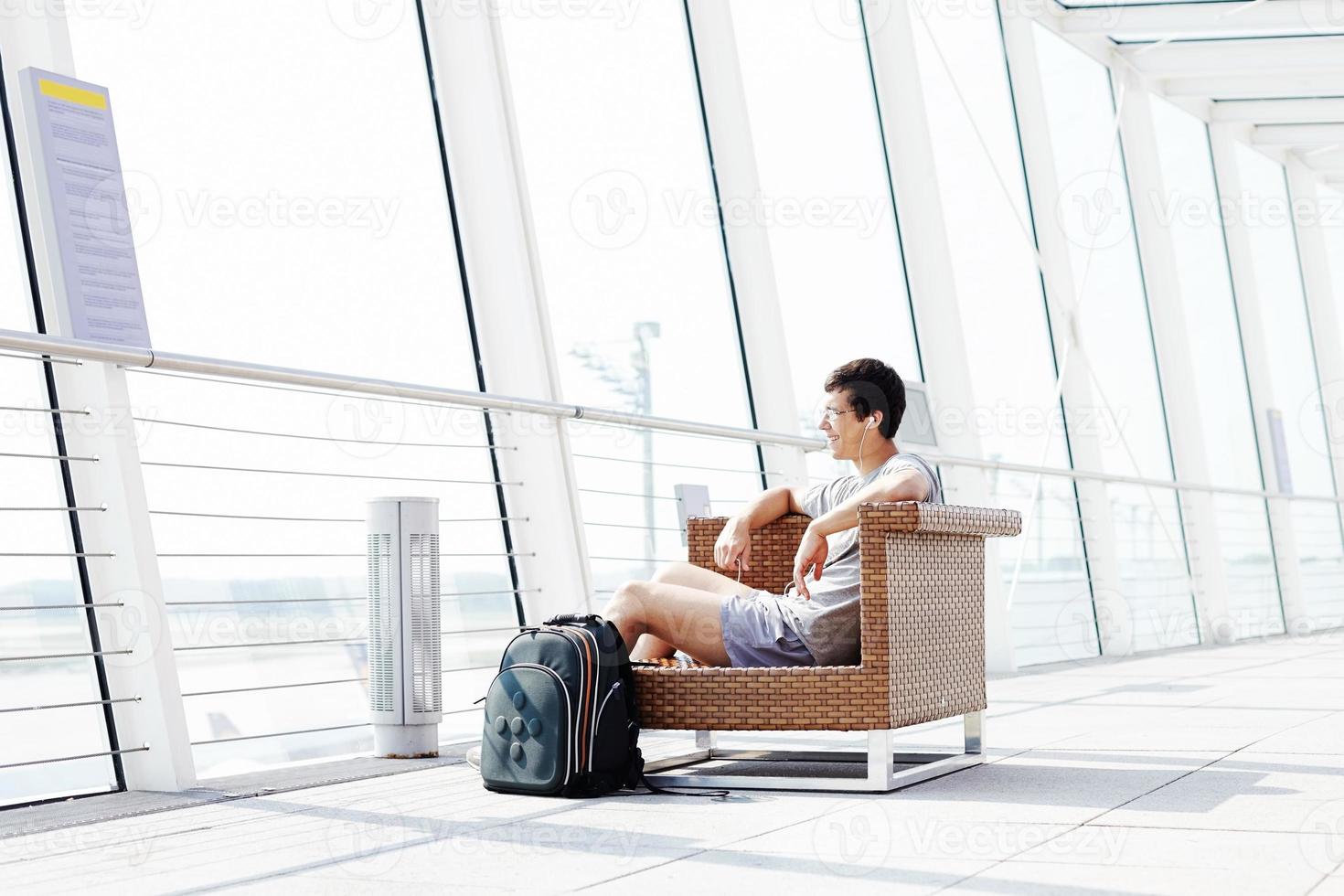 Guy resting in airport lounge photo