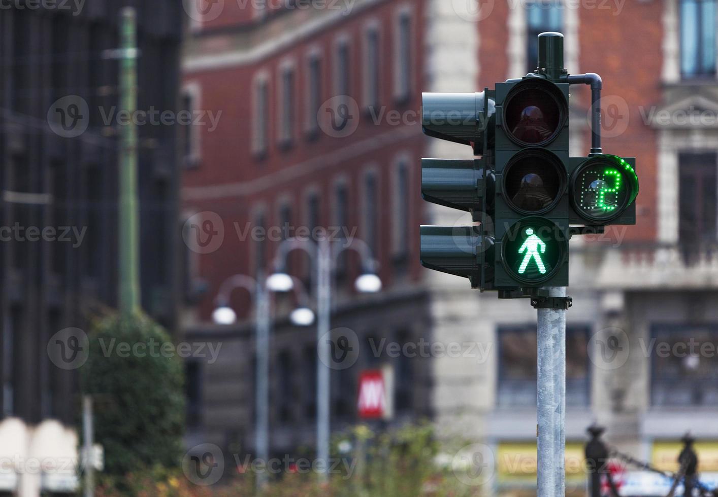 Traffic light with green light in Milan photo