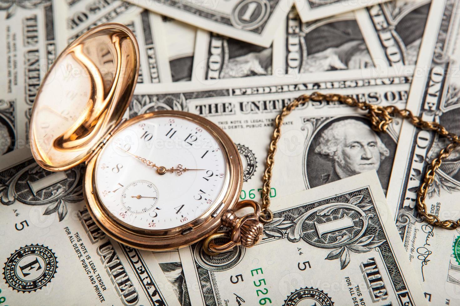 gold watch and dollar bills 715219 Stock Photo at Vecteezy