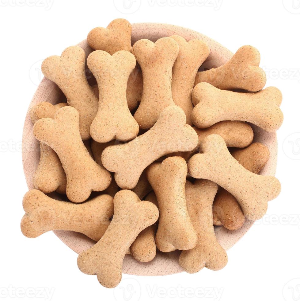 Snack food for dogs biscuits shaped as bone photo