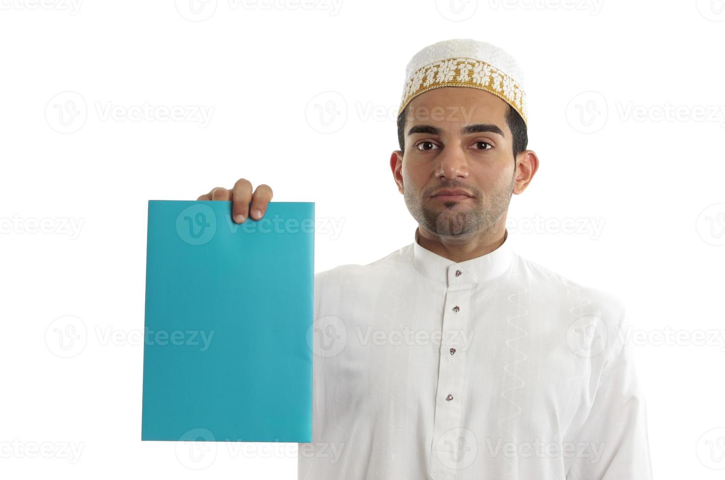 Ethnic businessman with brochure or advertisement photo