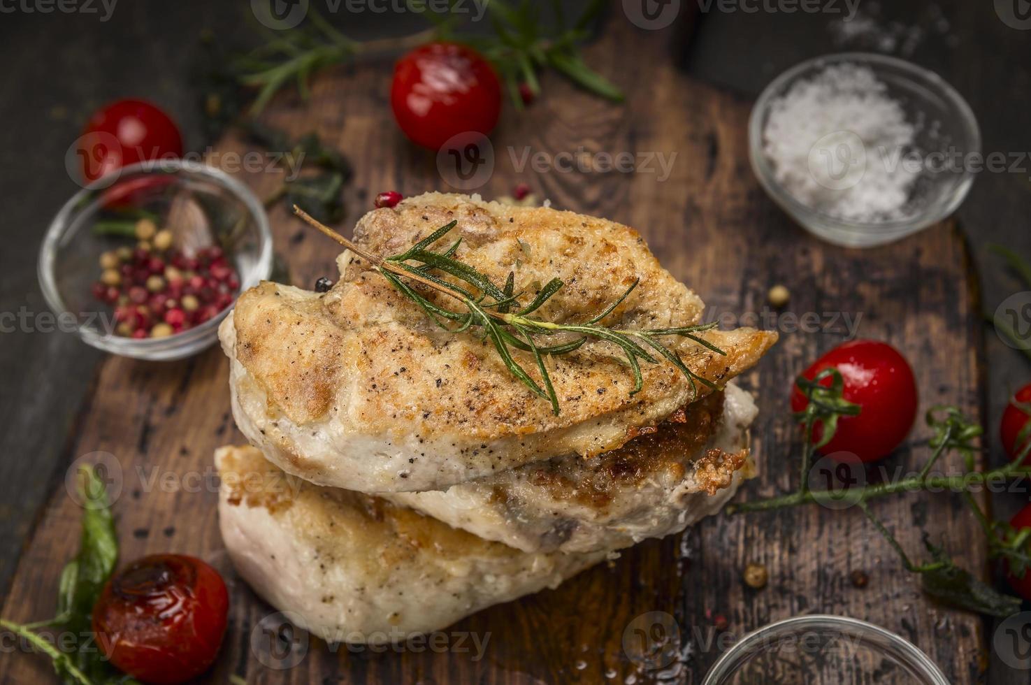 Grilled chicken breasts roast herbs rustic wooden background photo