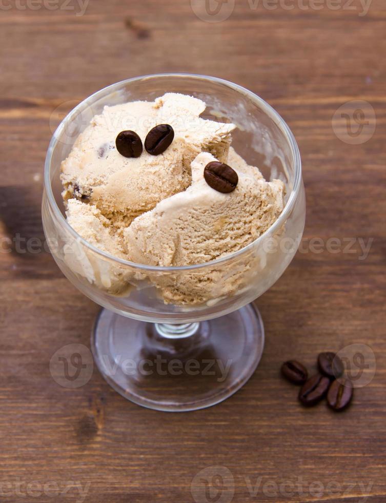 Cup of coffee ice cream on wood from above photo