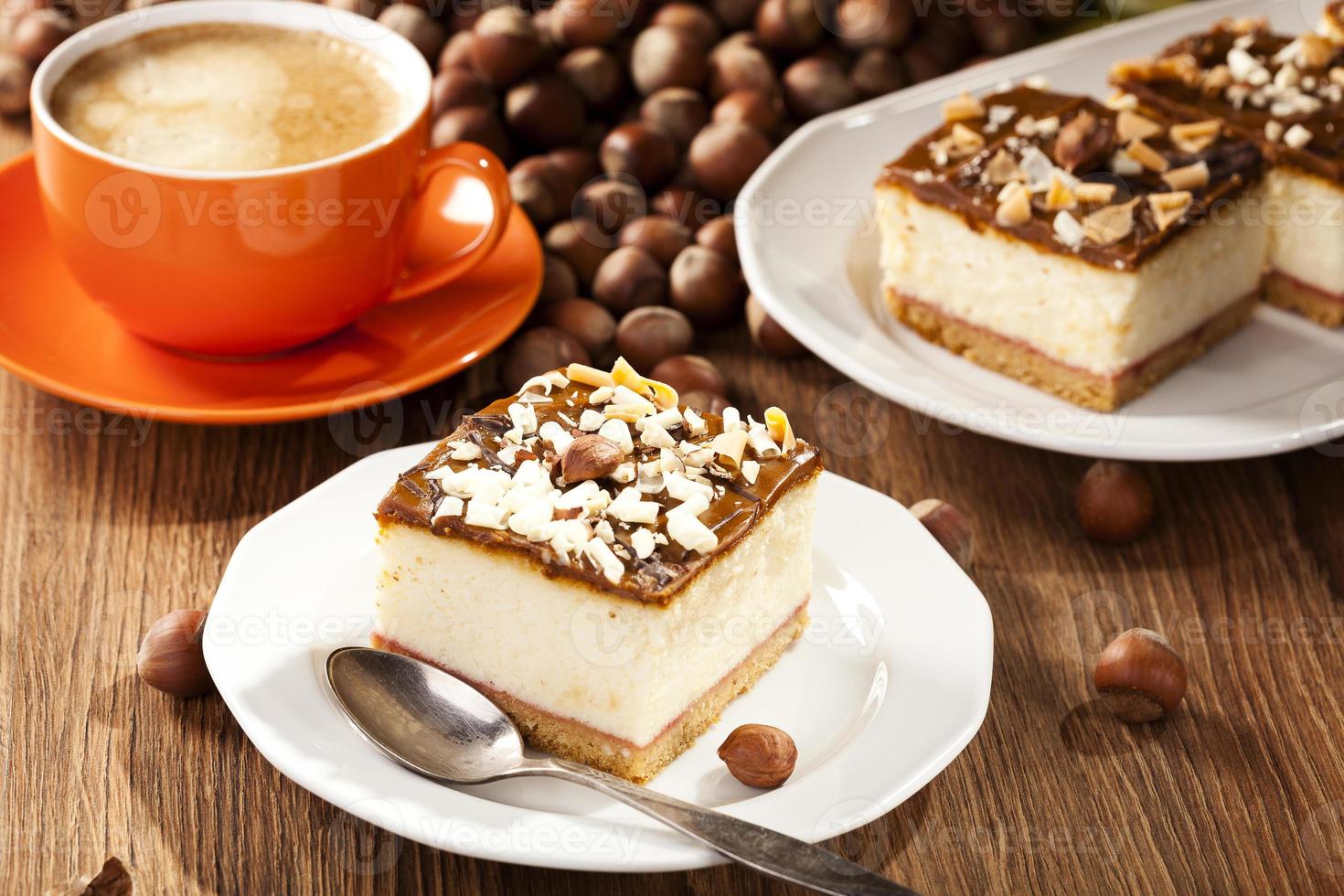 cheesecake with nuts on plate photo