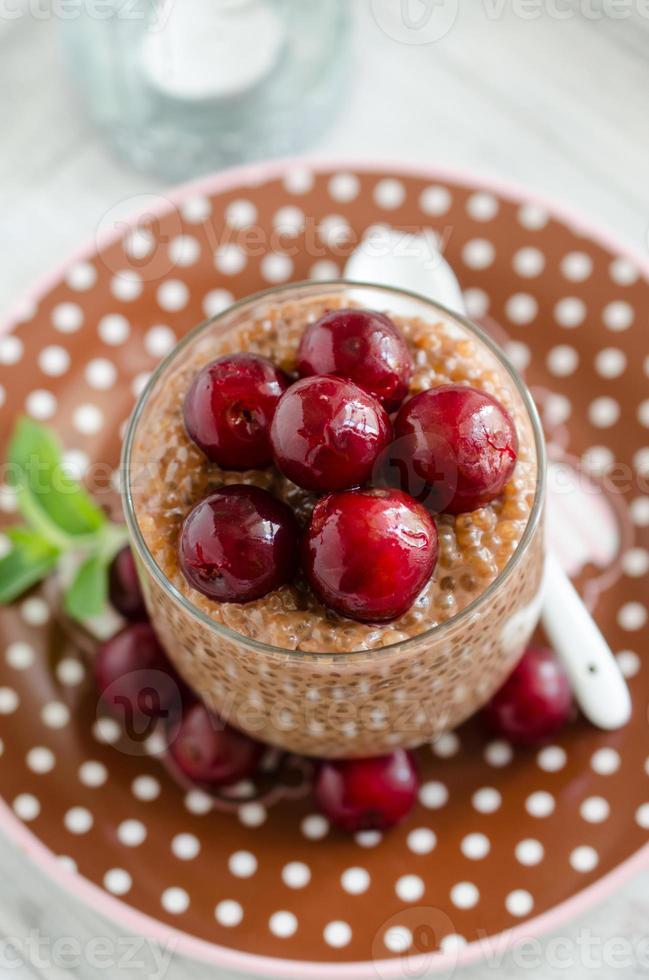 Chocolate tapioca pudding with cherries photo