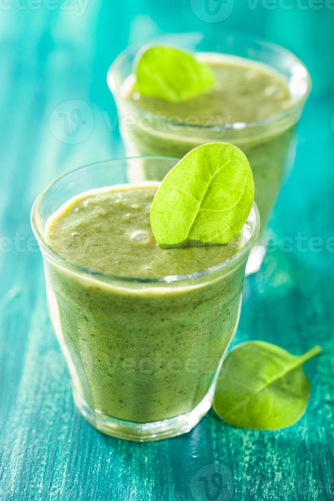 healthy green smoothie with spinach leaves photo