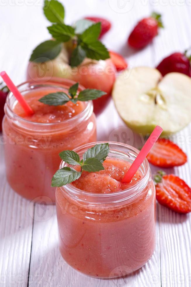 Apple Strawberry smoothie on a white table photo