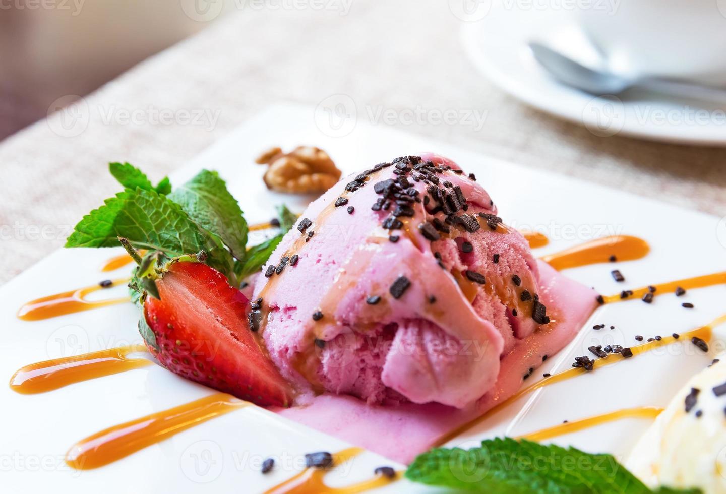 Three scoops of pistachio, strawberry and vanilla ice cream photo