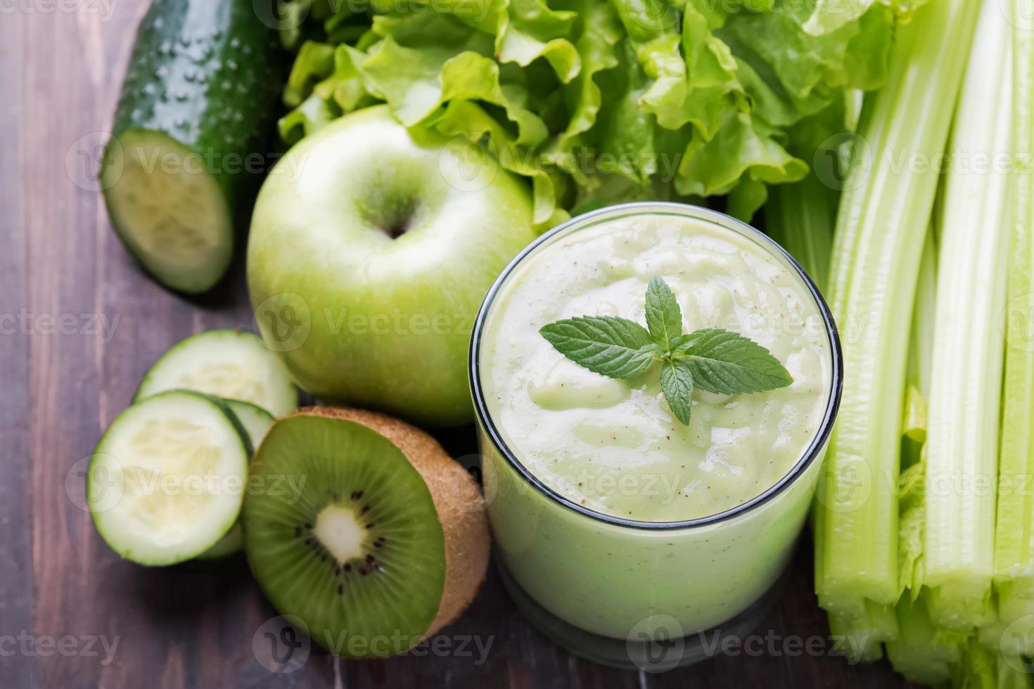 Green smoothie, vegetables and fruits photo