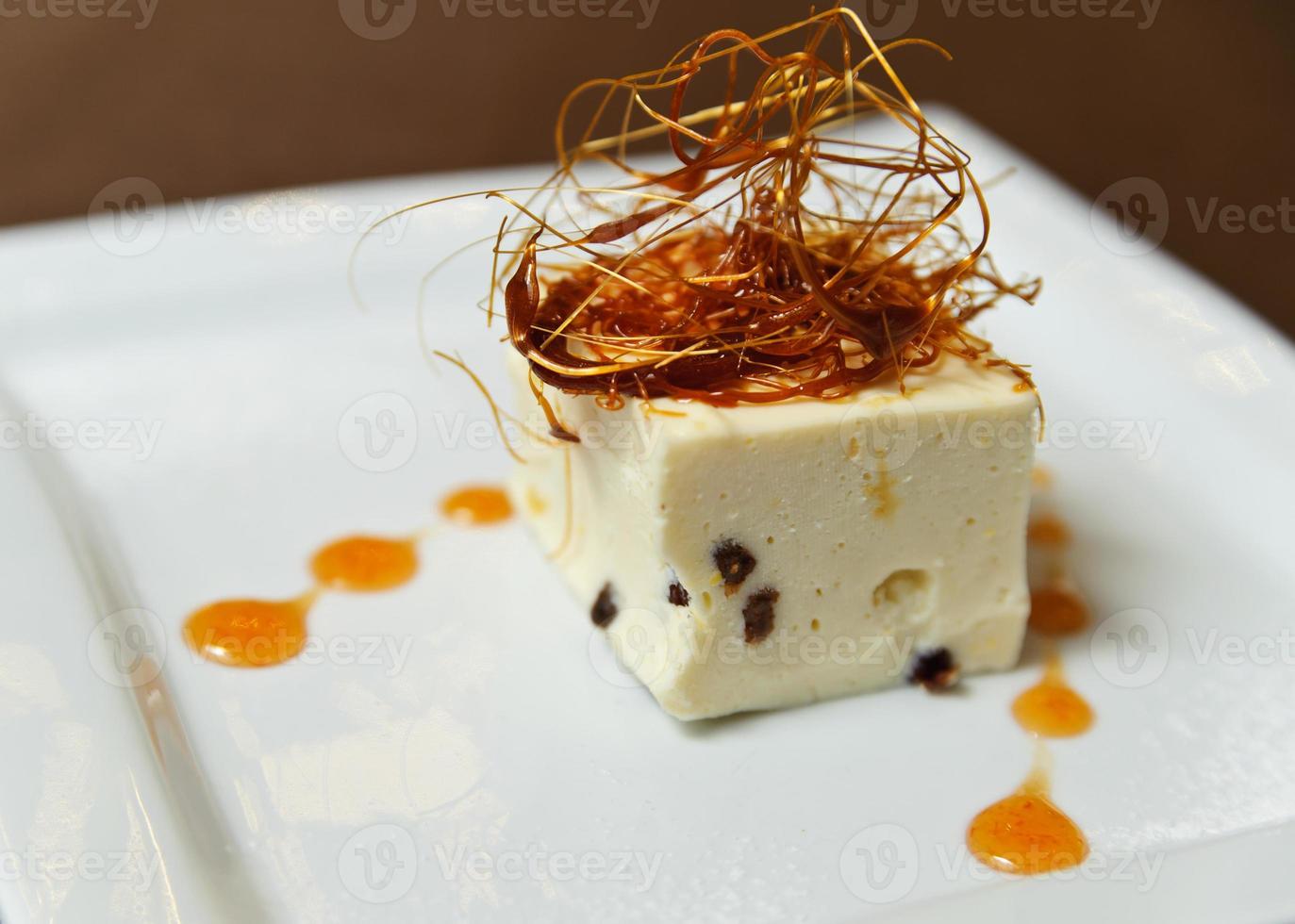 Dessert decorated with caramel threads photo