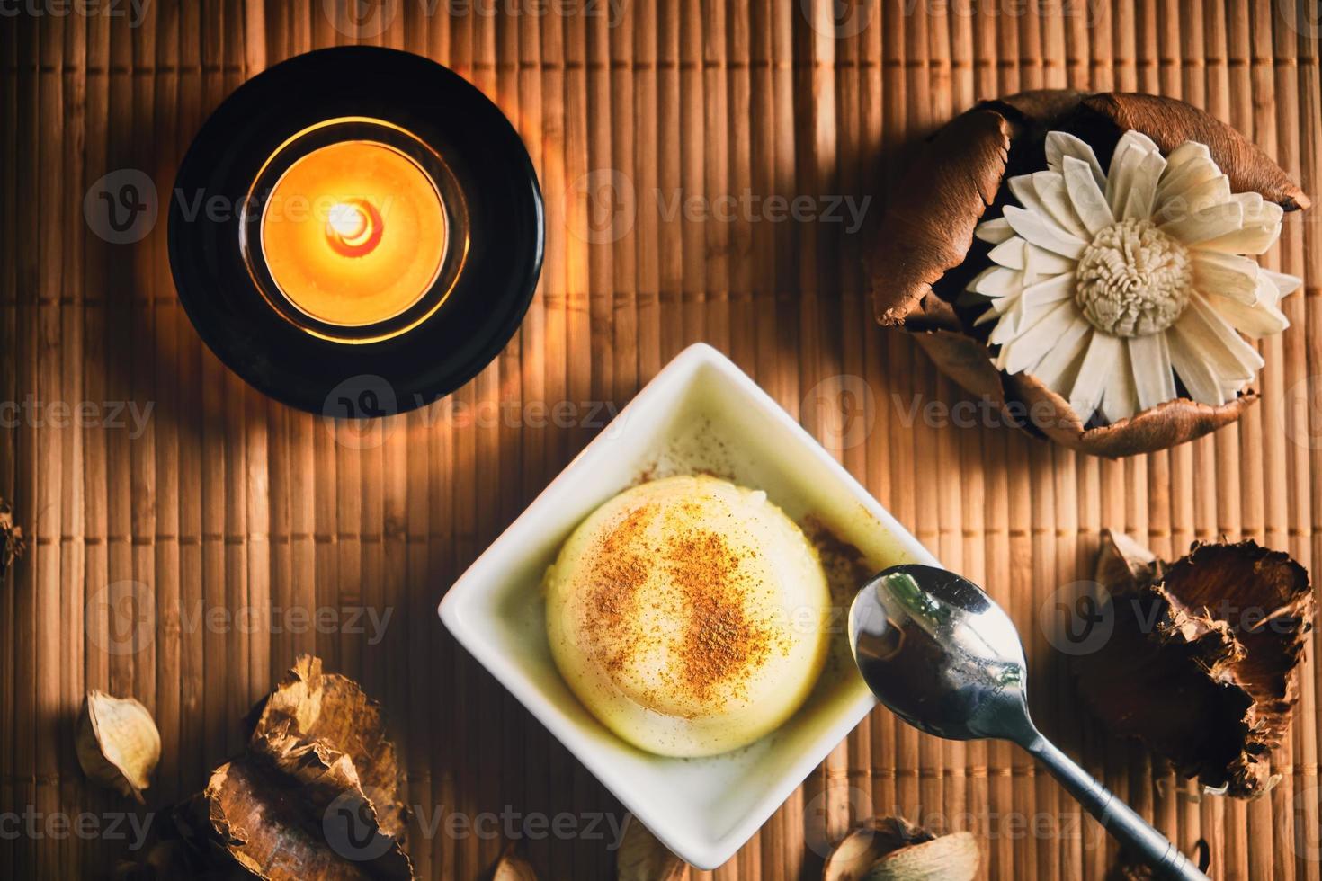 Vanilla pudding on a wood table photo