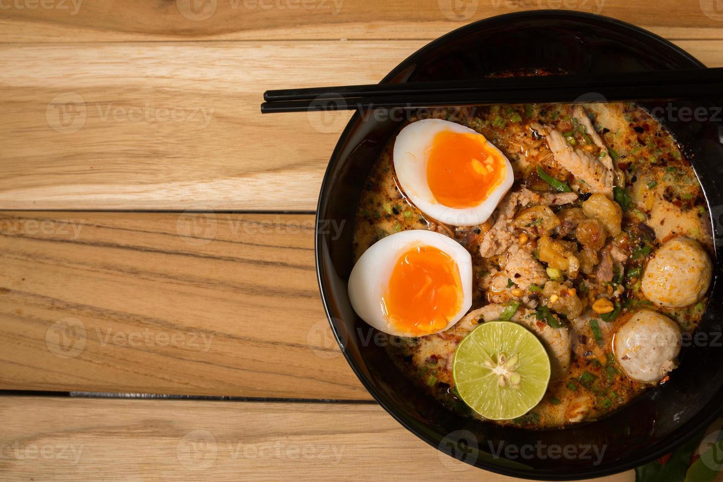 bowl of noodles with vegetables and soft boiled egg photo
